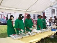 A picture of women setting up an outdoor picnic at Bethel Tabernacle.